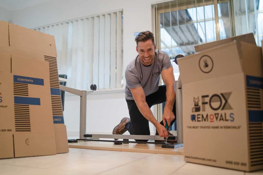 Fox Removals team member assembling furniture after a house move