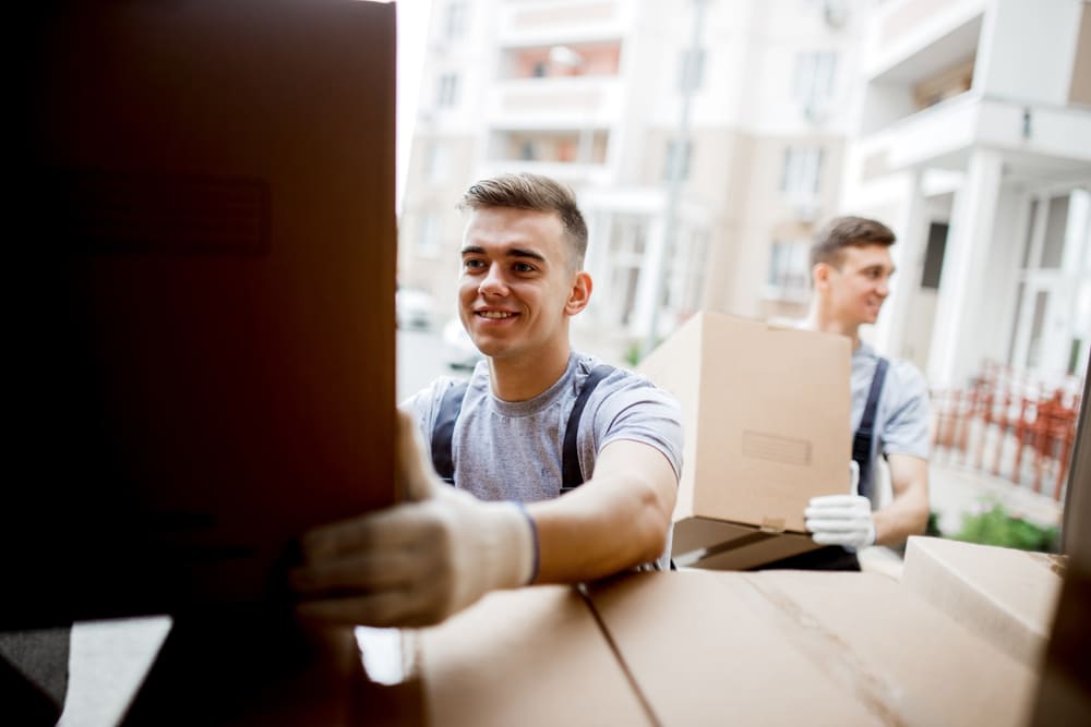 removalists putting boxes in the truck